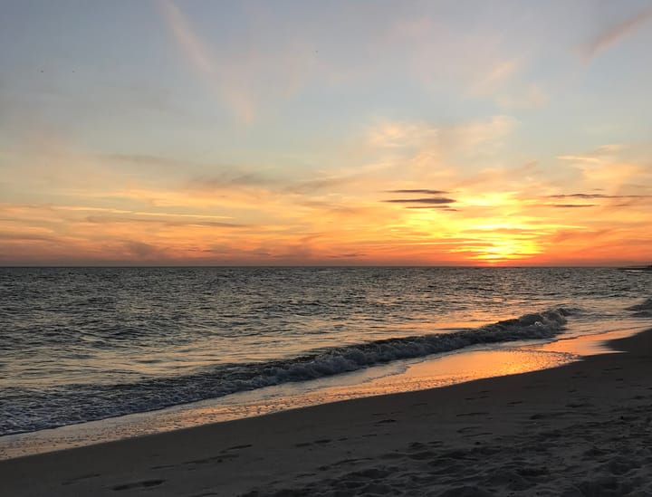 A white sand beach at sunset